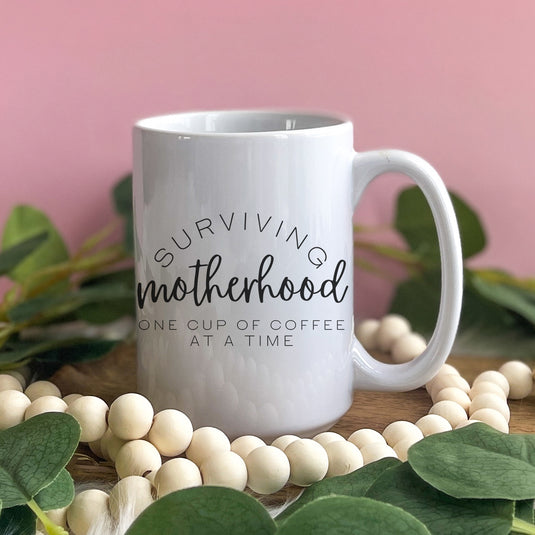 Surviving Motherhood One Cup At A Time Mug